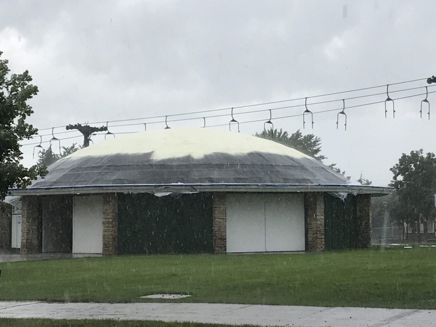 low building construction with domed ceiling during rainy weather