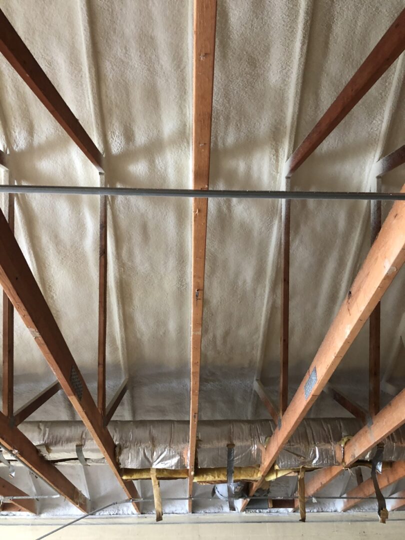 wooden beams with insulation on ceiling