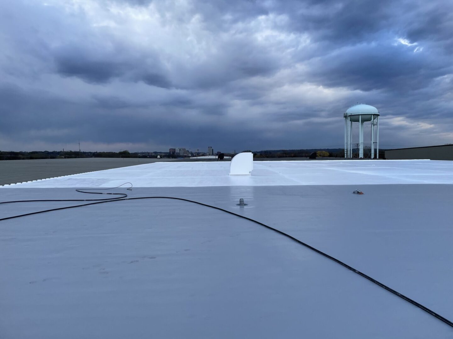 Industrial facility rooftop with insulation work