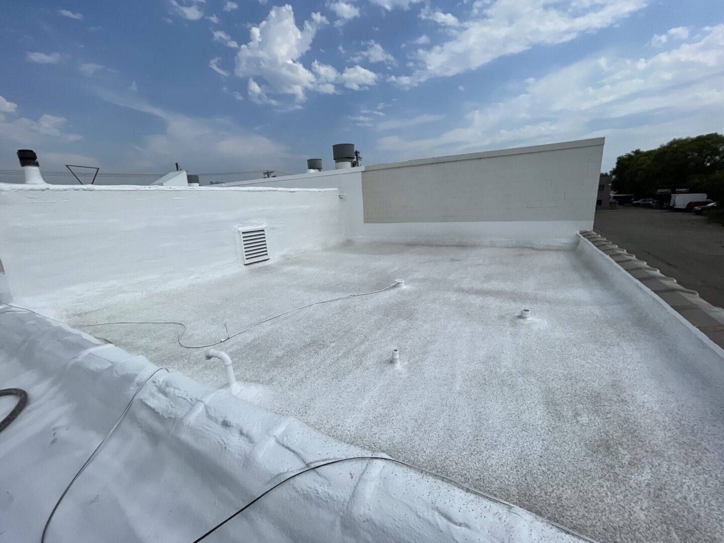 building rooftop with insulation spray