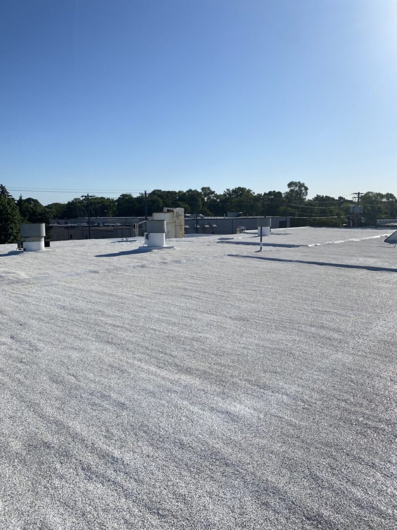 rooftop area of building property with spray insulation